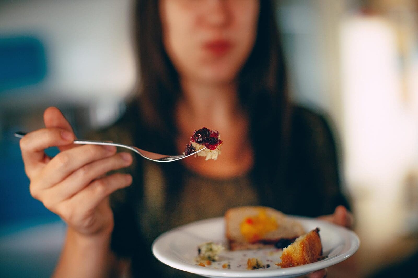 person with tiny bit of food on fork