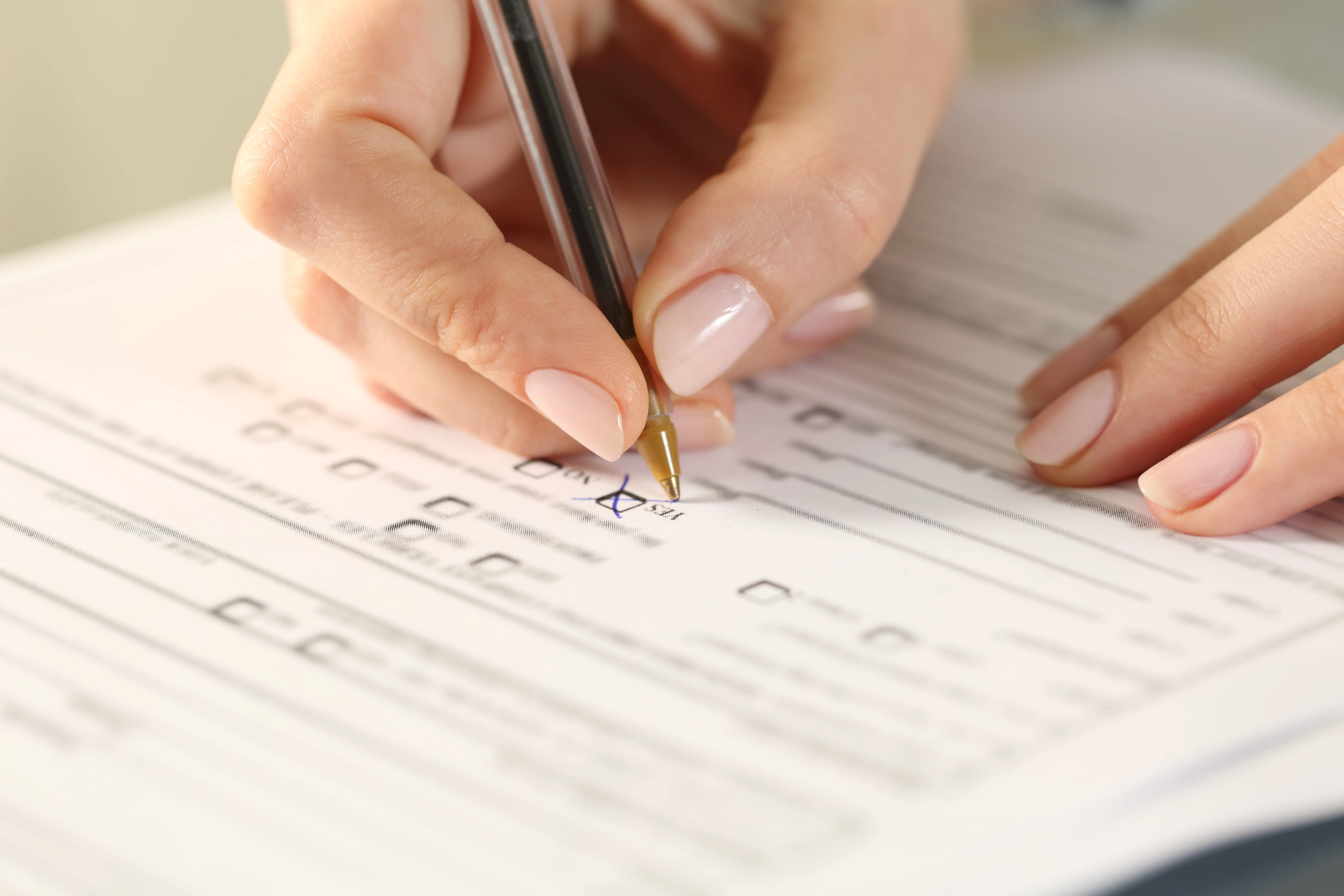 Female veteran filling out paperwork for a VA disability claim