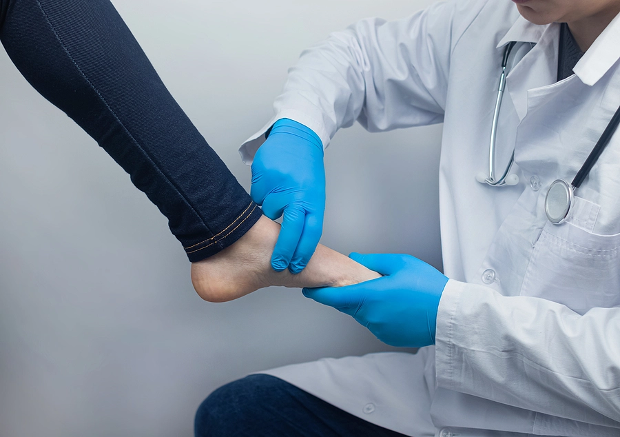 VA doctor perform an exam on a veteran with flat feet also known as pes planus