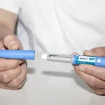 Veteran preparing to take an Ozempic injection to treat their Type II diabetes