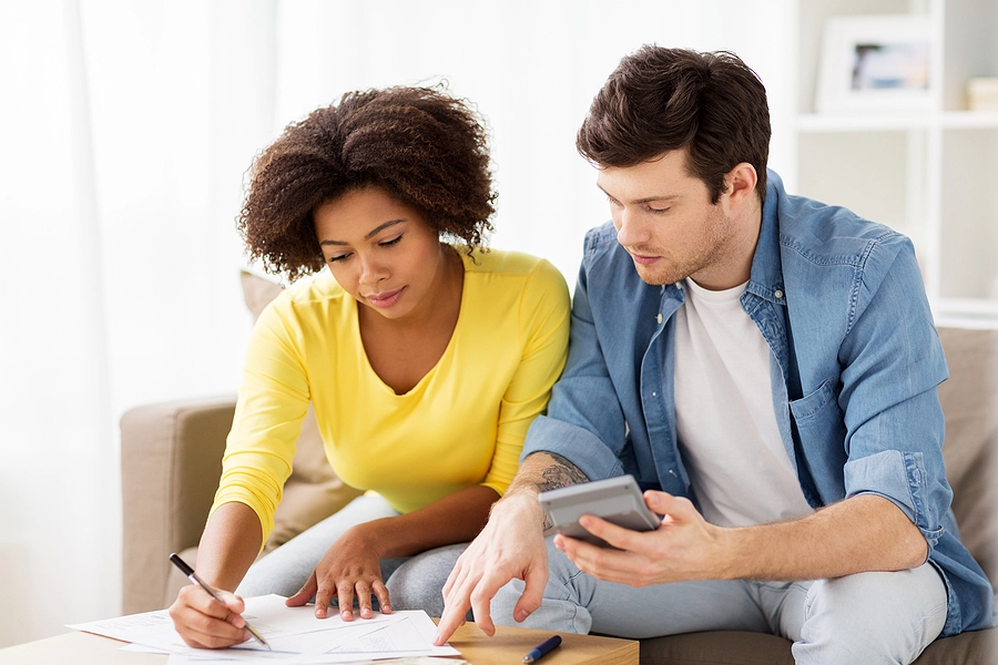 veteran and his wife looking at medical records trying to use a calculator to find his disability rating